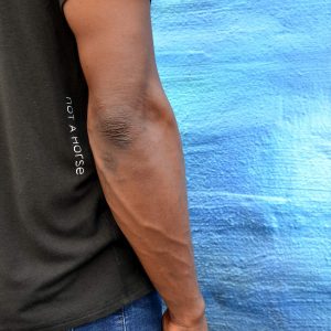 not a horse Men Icon T-Shirt Logo model wall side